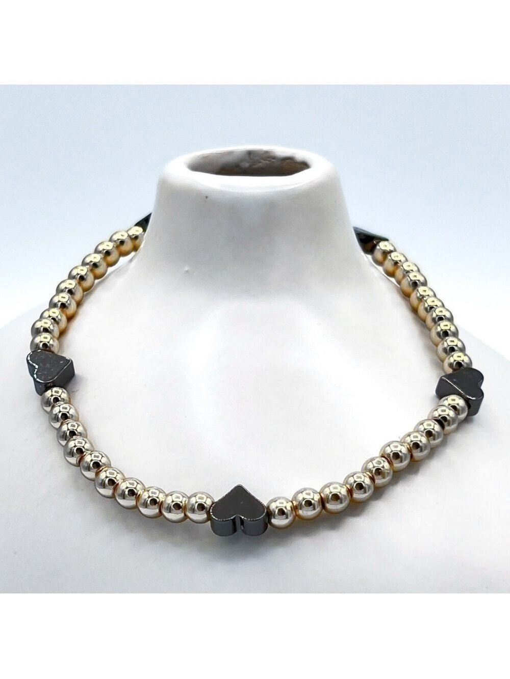 Gold beads with black hearts bracelet.